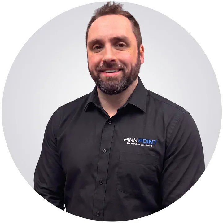 Jared Beeler, owner of Pinn Point Technology Solutions, in a black Pinn Point shirt